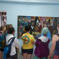 Examining artwork at El-Saieh Gallery in Petionville, Haiti